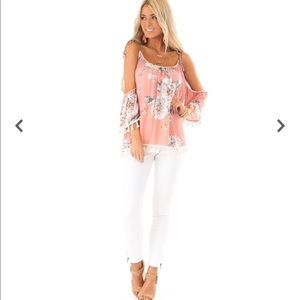 Cold shoulder floral print shirt.